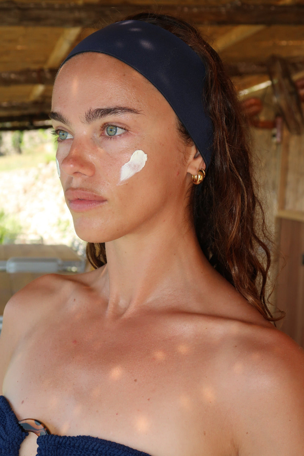 Woman with sunscreen on her face outdoors